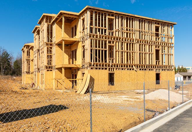 a close-up of temporary chain link fences enclosing a construction site, signaling progress in the project's development in Murfreesboro, TN